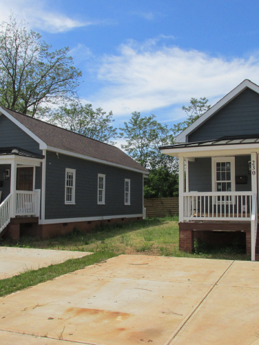 Exterior shot of two shotgun style houses on a sunny day in Charlotte, NC