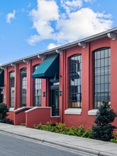 Exterior view of the Atherton Cotton Mills on a sunny day