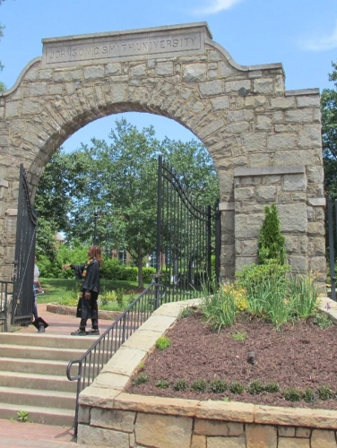 Exterior view of the JCSU Stone Entry Gates on a sunny day.