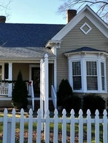 Front-facing exterior view of the Hooks-McLaughlin House on a sunny day