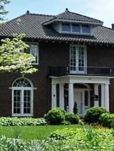 Exterior view of the Randolph Scott House on a sunny day
