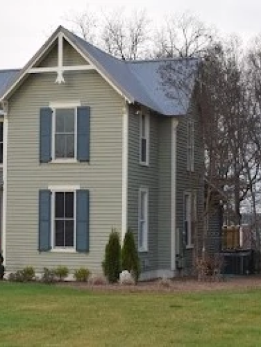 Exterior view of the Sherrill-Robbins House on an overcast day.