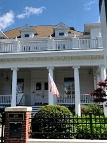 Exterior view of the Walter Brem House on a sunny day.