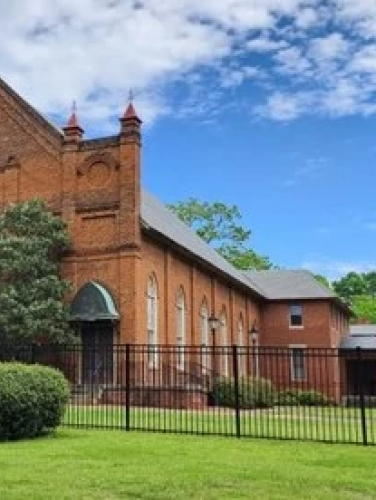 Exterior view of the Steele Creek Presbyterian Church on a sunny day.