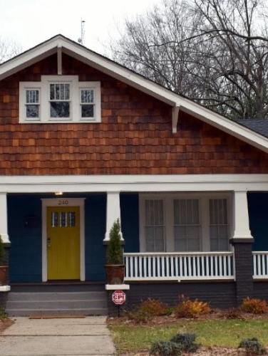 A front view of the Butler House on a cloudy day.